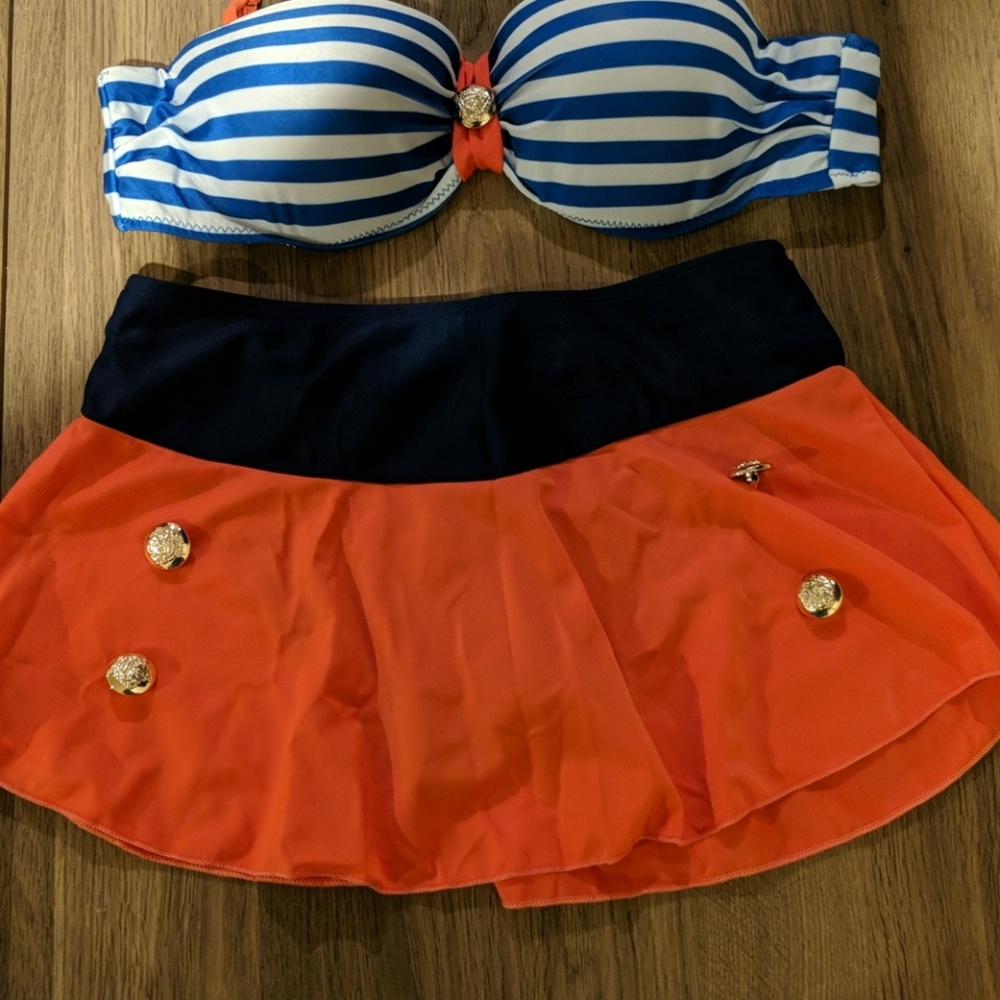 Never Worn 2 piece Swimming Suit, fits like medium